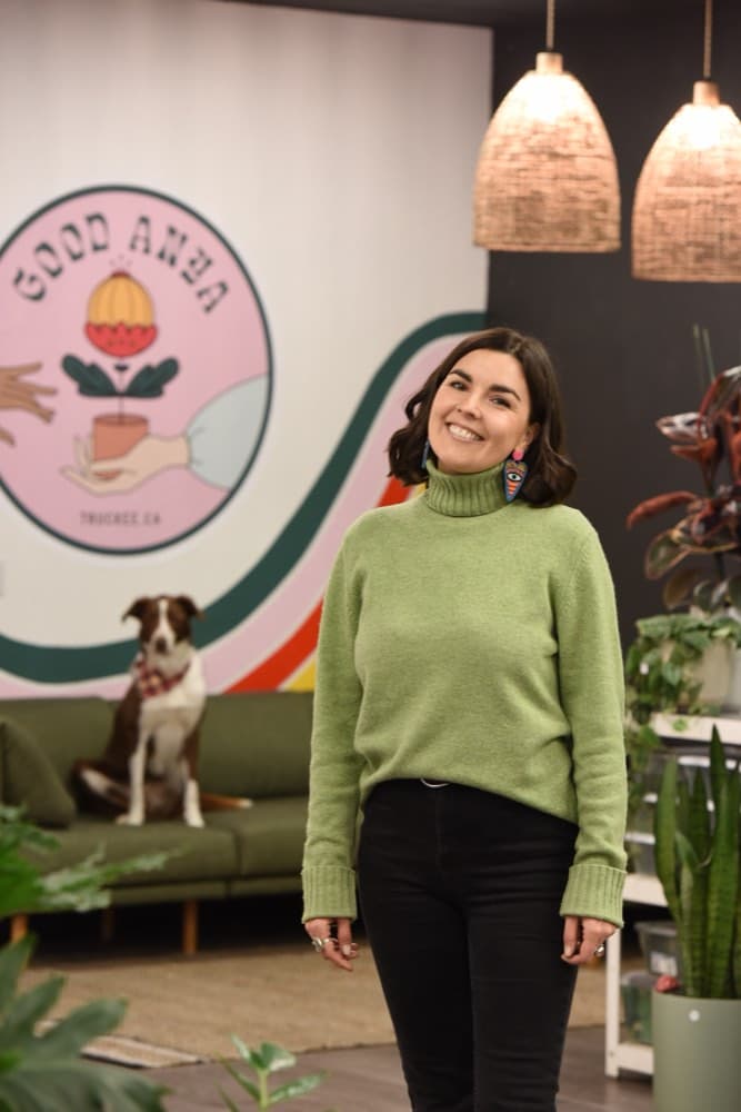 Anya in the studio in front of the Good Anya mural