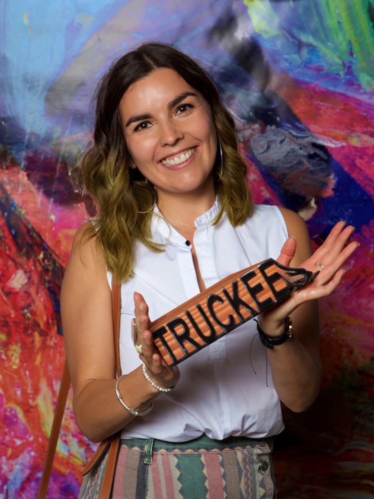 Anya holding a Truckee sign at the 2022 Chamber awards